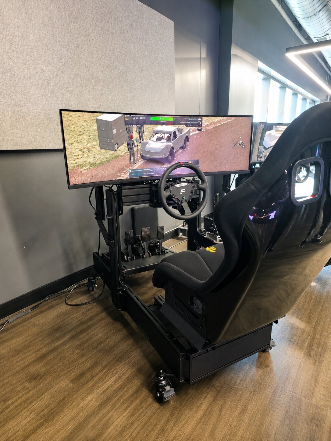 An Academy Sport custom sim racing build with a compact frame and racing seat